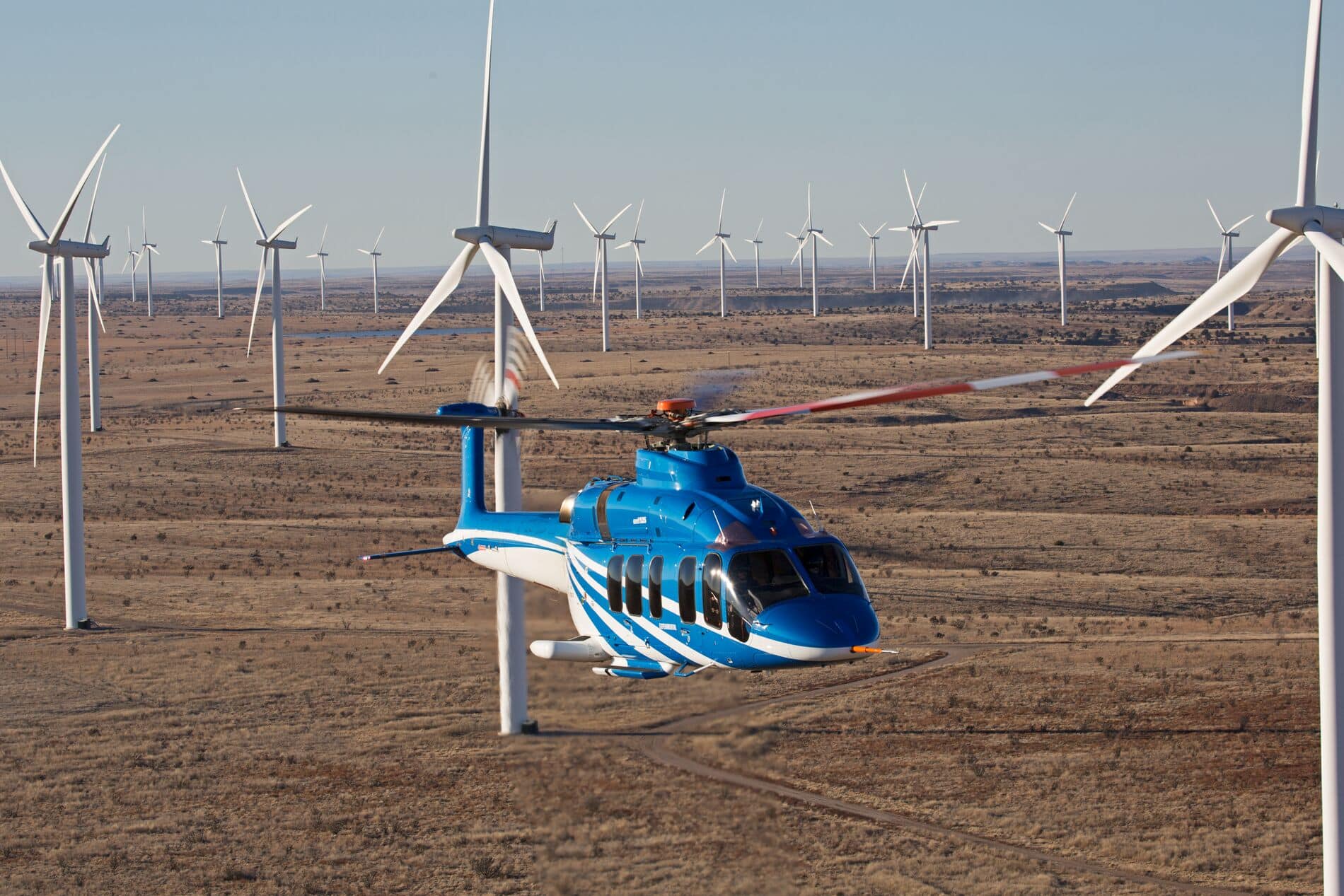 Bell 525 Flying Through Desert Windfarm